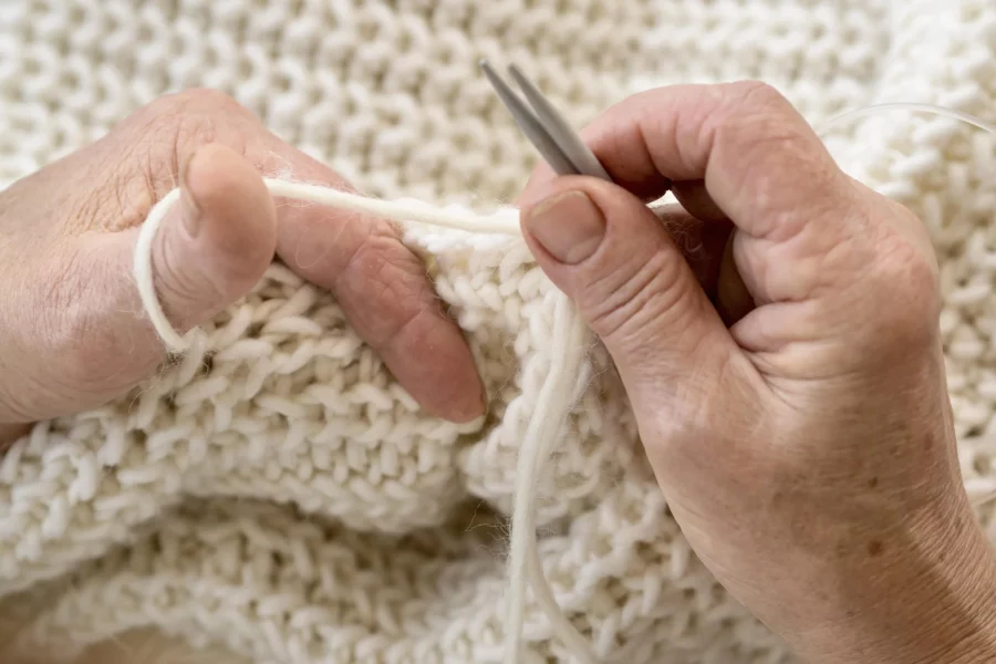 high-angle-person-crocheting